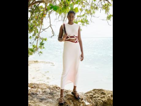 Cliffside at Destiny Villa in MoBay, Tash Ogeare wears a Christopher Esber dress, Vagabond Shoemakers sandals and a Mulberry bag.