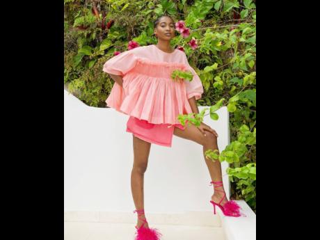 Pink is in for the season as Tash Ogeare rocks a Molly Goddard top, Rejina Pyo Jamilla silk chiffon skirt and Zara feathered heels.