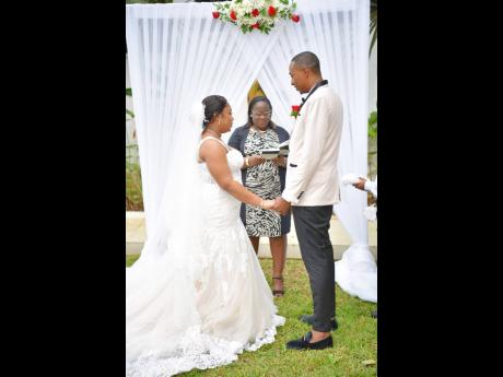 The entrepreneur is also a marriage officer. Here she is
officiating the wedding of L’tauna Matthews and Sharma Wright at JamGolia Place in Mandeville.