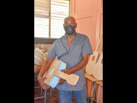Douglas and his team are currently making costumes for 200 of the 1,000 revellers who will participate in the float and street parade on August 1. This guitar is in the early stage of construction. 