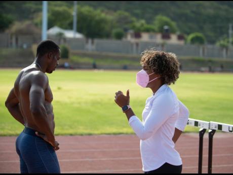 File  Photos
Coach Brigitte Foster-Hylton working with hurdler Ronald Levy at a MVP Track and Field Club training session at Stadium East in St Andrew in June 2021. Levy won a bronze medal at the Olympic Games in Tokyo, Japan, less than two months later, b