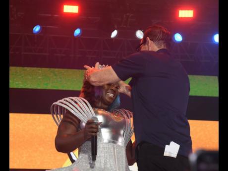 Below: Queen of the Dancehall Spice (left) is crowned by Joe Bogdanovich, the promoter of Reggae Sumfest and chief executive officer of Downsound Entertainment.