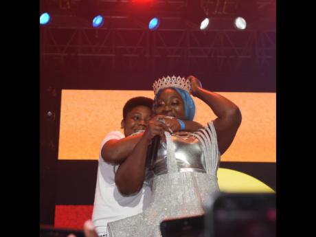 Grace ‘Spice’ Hamilton is embraced by son, Nicholas Lall Jr, following her crowning as Queen of the Dancehall.