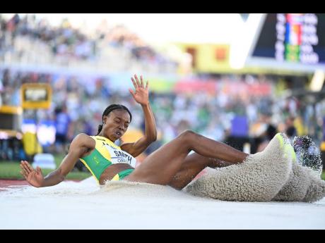 Jamaica’s Ackelia Smith lands in the sandpit during the women’s triple jump final on day four of the World Athletics Championships at Hayward Field on Eugene, Oregon on Monday.