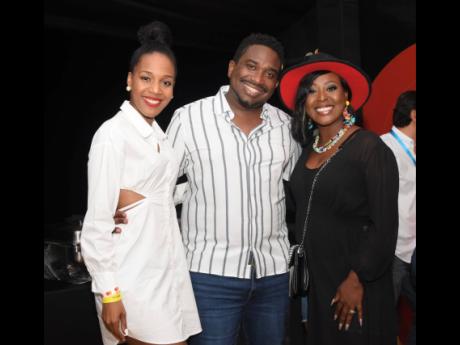 Host and author Dr Terri-Karelle Reid; Aldwyn Wayne, chief  executive officer, WiPay Group; and Alysia Moulton White, vice-president of marketing, Sagicor, were captured inside the MasterCard booth on night two of Reggae Sumfest. 