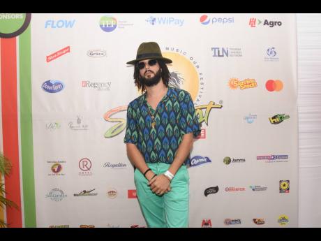One of the night’s early performers, Irie Souljah posed for our cameras inside the Reggae Sumfest media tent. 