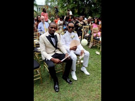 Best man Tavares Smith sits patiently by his brother’s side as they await the entrance of the bridal party and bride. 