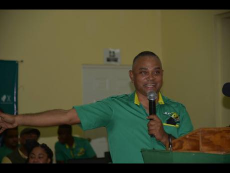 Jamaica Labour Party (JLP) stalwart Michael Stern addressing the JLP divisional meeting at the Nain Basic School in Nain, St Elizabeth, on Sunday.