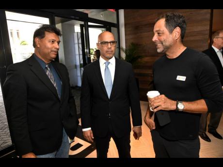 We caught (from left): Ian Persaud, vice-president of finance and corporate planning for Jamaica Broilers Group Limited; Financial Analyst Phillip Armstrong and Marc Melville, chief executive officer of Chukka Caribbean Adventures, deep in conversation.