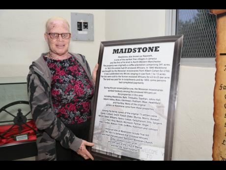 Ava Frith, curator of the Maidstone Museum, shows an information board about Maidstone’s history.