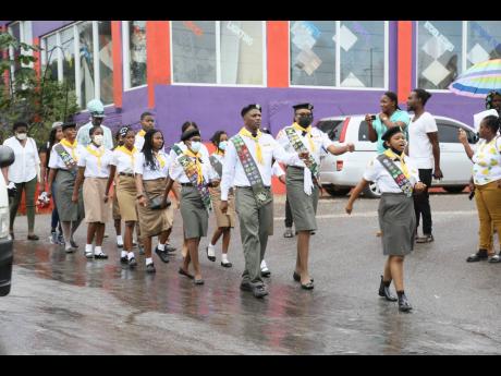 Pathfinders make their way along the parade route on Thursday.