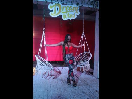Kitty B, a model and model coordinator from Washington, DC, shows off her outfit that was put together to match the red and white theme of the event. This was her first time attending Dream Weekend. She says she is planning to slay the looks all weekend lo