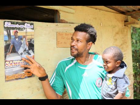 48-year-old Carlton Simpson was the casualty of a three-vehicle collision on the Content main road on May 17. A jovial and respected community member, his picture hangs on corner shops as his friends and relatives plan his final rites. Here, relative Josep