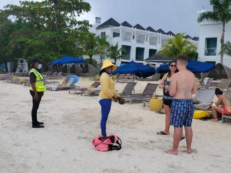 Private security personnel employed to the hotels stood between guests relaxing along the beach by the properties and several vendors competing to sell bracelets and other items. A friendship bracelet costs US$5, while some offered hair braiding for US$20.