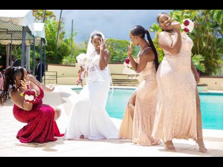 Wife moves: The bride, Princess (second left), shows off her wedding ring with her girls (from left) maid of honour and sister, Cavel Morrison, and bridesmaids, Shannon Thorpe and Shara Montaque.