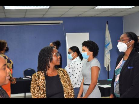 Facilitator Janella Precius (left), guides participants through an exercise aimed at making meaningful eye contact during speech delivery.