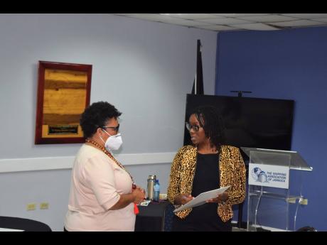 Presenter Janella Precius (right) and Seaboard Jamaica CEO Corah Ann Robertson Sylvester share a moment during last week’s public speaking workshop.