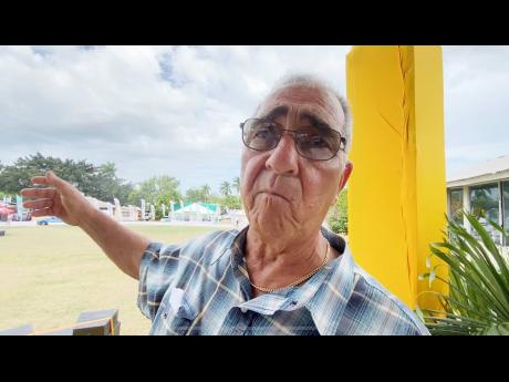 William Shagoury, custos of Clarendon, makes a point during the Denbigh Agricultural, Industrial and Food Show on Sunday.