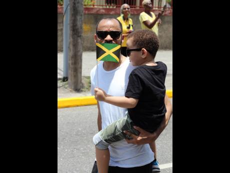 Emancipation Day was all about father and son bonding time for Ricardo and Zev Clarke who walked along the streets of Kingston following the parade.