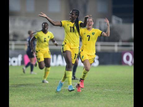 Jamaica’s Khadija Shaw celebrates scoring a goal against the Dominican Republic in a FIFA Women’s World Cup qualifier at Sabina Park recently as teammates Chinyelu Asher (right) and Courney Douglas join in the jubilation. 