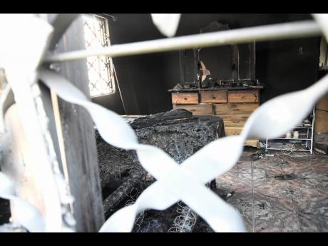 The interior of one of three homes torched in a night of terror in Gregory Park, Portmore. 