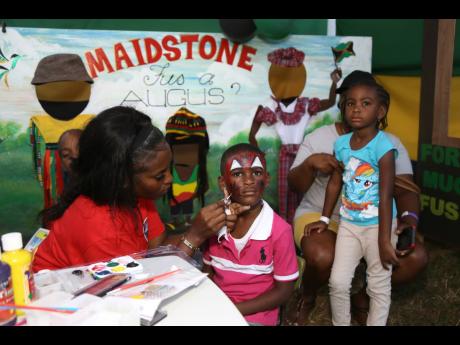 Face painting was one of the activities in which children participated at the Fus A Augus celebration in Maidstone on Emancipation Day. 
