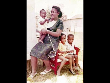 Sylvia Kirlew holds her Independence gem Topaz while siblings Therese (second right) and Konrad look on.