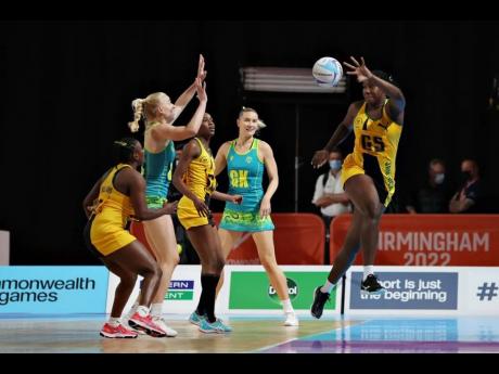Jamaica’s Jhaniele Fowler controls the ball during a Netball Pool A match against Australia on day seven of the Birmingham 2022 Commonwealth Games at NEC Arena in Birmingham, England yesterday. 