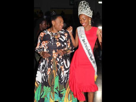 Minister of Culture, Gender, Entertainment and Sport Olivia ‘Babsy’ Grange (left) and the 2022 Miss Jamaica Festival Queen Velonique Bowen rub shoulders as they dance to a few old school dancehall hits.