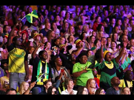 Sunshine Girls fans show their support during the netball Pool A match against Australia on day seven of the Birmingham 2022 Commonwealth Games at NEC Arena on Thursday.