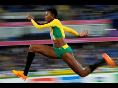 Shanieka Ricketts of Jamaica makes an attempt in the Women’s triple jump final during the athletics competition in the Alexander Stadium at the Commonwealth Games in Birmingham, England, yesterday