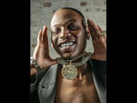 American rapper, Flipp Dinero, shows off his bling for the camera.