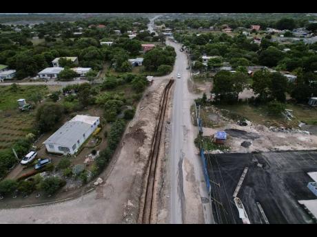 
Road work in Yallahs, St Thomas where  Part D of the South Coast Highway Improvement Project stretches from the Yallahs Bridge in St. Thomas to Port Antonio in Portland.