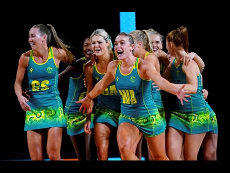 Australian players celebrate after winning the Netball gold medal match against Jamaica inside the NEC Arena on day 10 of the 2022 Commonwealth Games in Birmingham, England, yesterday.
