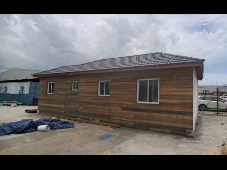 The rear of a two-bedroom container home under construction at Kingston Logistics Center Limited.