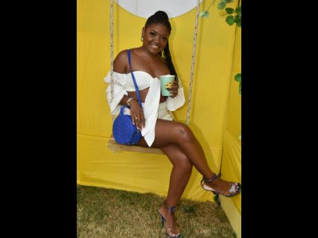Swinging in white and a statement blue purse, Abigail Nankoo was in a blissful mood.