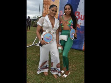 Rayhnah Spence (left) and Meci Ellis were not about to let go of their Best Weekend Ever paper fans.