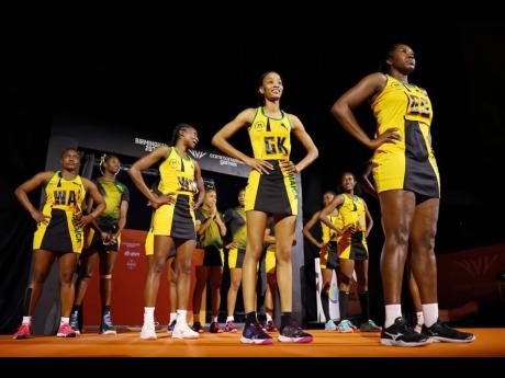 Jamaica’s Sunshine Girls walk onto the court during the netball gold medal match against Australia on day 10 of the Birmingham 2022 Commonwealth Games at NEC Arena on Sunday in Birmingham, England. 