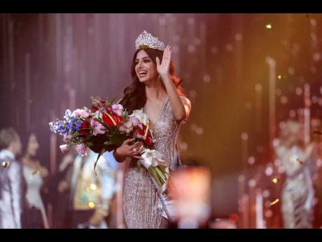 India's Harnaaz Sandhu waves after being crowned Miss Universe 2021 during the 70th Miss Universe pageant in Eilat, Israel. Come 2023, Miss Universe is to allow married or divorced women and women who are pregnant or have children to compete.