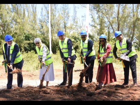 Prime Minister Andrew Holness (third left) breaks ground with (from left) Alejandro Sanchez (operations director for Jamaica Bahamas & USA); Carmen Riu (owner of RIU Hotels & Resorts Chain); Edmund Bartlett (minister of tourism); Tova Hamilton (member of p