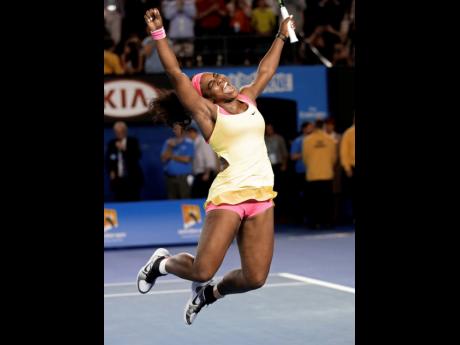 Serena Williams celebrates after defeating Maria Sharapova in the women’s singles final at the Australian Open tennis championship in Melbourne, Australia, Saturday, Jan. 31, 2015. 