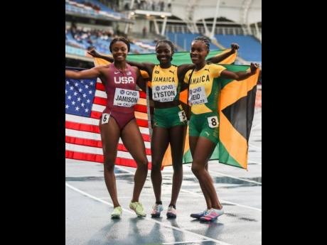 From left: the United States’ Jayla Jamison poses with Jamaica’s Brianna Lyston and Alana Reid after the three copped the medals in the women’s 200 metres at the World Under-20 Championships in Cali, Colombia on Friday. Courtesy of World Athletics