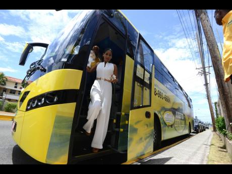 Minister Lisa Hanna exits a Jamaica Urban Transit Company bus at the Bob Marley Museum during city tour on Emancipation Day, August 1, 2015. She revealed Tuesday that she will be leaving representational politics.