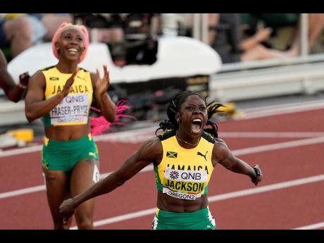 Jamaica’s Shericka Jackson (right) roars after winning the women’s 200 metres ahead of an impressed Shelly-Ann Fraser-Pryce at the World Athletics Championships on Thursday, July 21, 2022, in Eugene, Oregon.