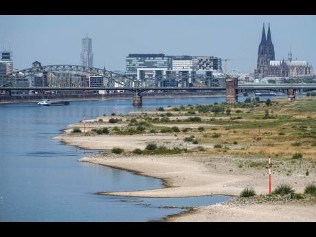 The Rhine River is pictured with low water in Cologne, Germany, on Wednesday, August 10.