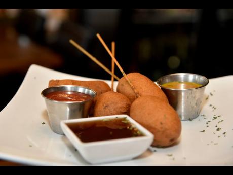 The savoury corn dog offering at Uncorked Too served with sweet dipping delights of ketchup, in-house syrup and honey mustard. 