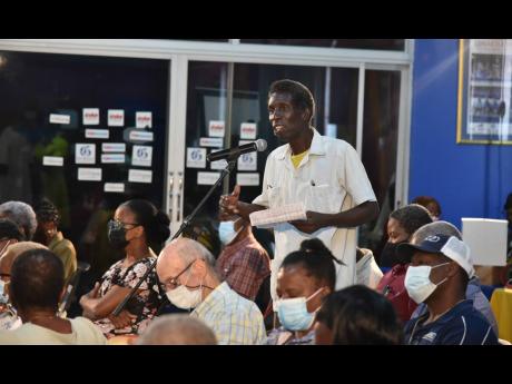 Shareholder Lenzel Bloomfield asks a question during the annual general meeting of 1834  Investments held at The Gleaner Company (Media) Limited on Wednesday. 