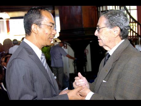 Dr Horace Chang (left) speaking with Dr Henry ‘Marco’ Brown at an event in St James in 2008.