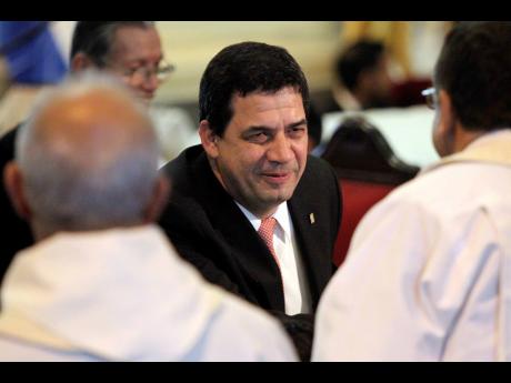 FILE – Paraguay’s Vice President Hugo Velazquez smiles during “Te Deum” at the Cathedral in Asuncion, Paraguay, August 15, 2018. Velazquez has been included on a US list of politicians considered to be corrupt, according to US ambassador to Paragua