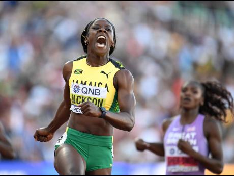 World 200 metres Champion, Jamaica’s Shericka Jackson, celebrates her victory in the final of the event in Eugene, Oregon on Thursday, July 21.